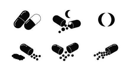 Black capsule pills in various states of opening and spilling contents