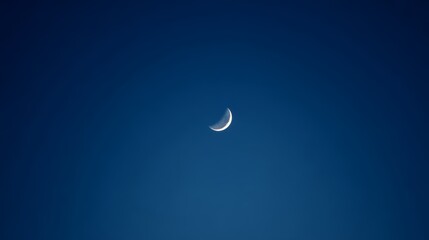 Fototapeta premium Crescent moon against clear night sky