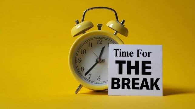 Yellow alarm clock and time for the break sign on vibrant yellow background