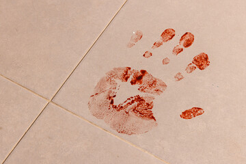 Bloody handprint crime scene on floor tiles