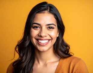 Smiling woman against yellow backdrop