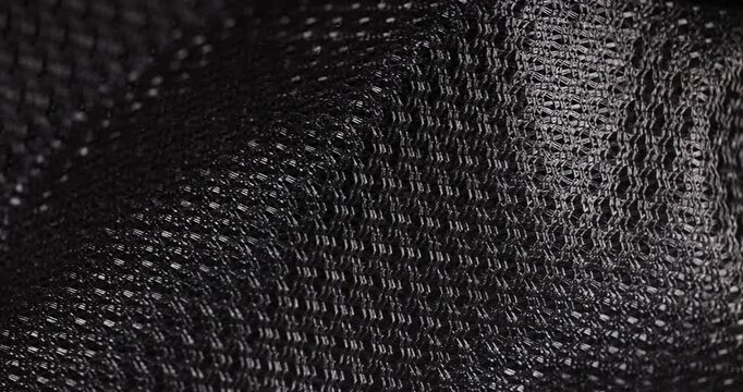 woven fabric to ensure air circulation, black thick fabric to provide ventilation at the back of backpacks and bags, close up