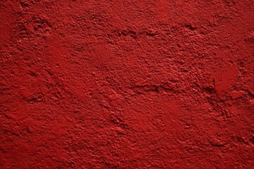 Textured red wall surface with rough pattern and depth