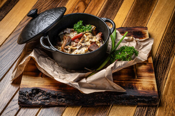 Traditional mushroom stew in a cast iron pot