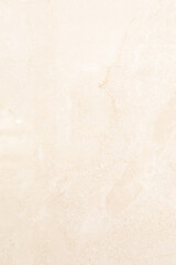 Light beige textured surface showcasing subtle patterns and variations