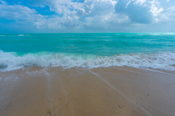 Tropical coastline. Exotic sea beach destination. Foamy sea beach waves. Sunny sea beach holiday. Relaxing sea beach vacation.