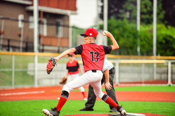 Young boy play baseball on summer day