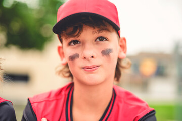 Young boy play baseball on summer day
