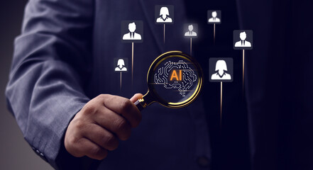 Businessman holds a magnifying glass over a brain AI icon, symbolizing the use of artificial intelligence for candidate screening and recruitment. A concept for HR technology and talent acquisition.