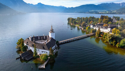 Austria tourism and scenic places. Beautiful white castle Ort (Schloss Ort) in the middle of Lake Traunsee, at Gmunden town