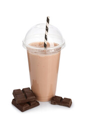 Tasty milkshake in plastic cup and chocolate pieces isolated on white