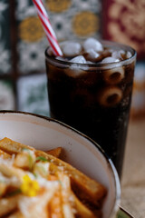 fried potato's in a bowl whit drink