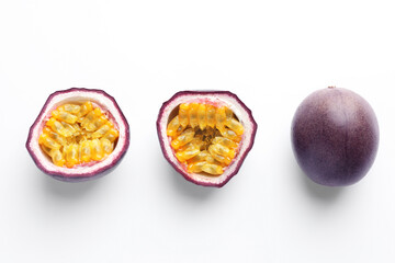 Fresh passion fruits on white background, top view. Whole and cut