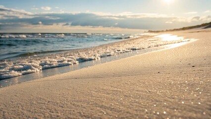 Golden sand dunes on beach at sunset
Close-up of soft sand dunes on a tranquil beach with ocean waves and golden sunset light creating a peaceful, relaxing atmosphere.
