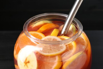 Fruity punch on black table. Refreshing drink