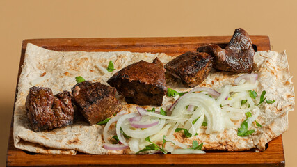 Kebab assortment on wooden tray