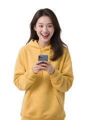 Joyful woman in yellow hoodie uses phone on transparent background. Ideal for social media, branding.
