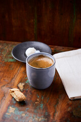 Cup of coffee on rustic wooden background. Soft focus. Copy space	