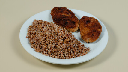 Buckwheat with cutlets on plate