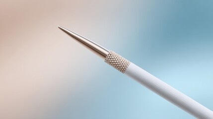 Naklejka premium Artistic close-up of a smooth white knitting needle with metallic tip creative workspace macro photography serene background