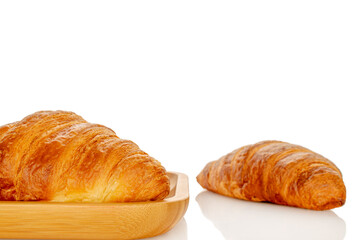 Chocolate croissants isolated on white background, close-up.