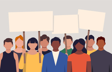 Diverse group of protesters standing together in a line, holding empty white rectangular signs on wooden poles.