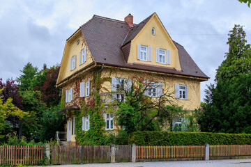 Residential house with ivy covered facade and pitched roof, Germany, Bobingen, 5 September 2025