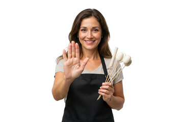 Woman in apron holding dried flowers isolated on transparent background