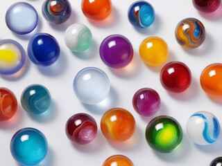 Glass marbles resting on bright surface