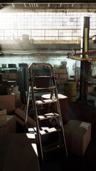 A ladder positioned among numerous stacked boxes in an old auto repair shop warehouse.
