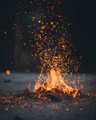 Burning fire with flying sparks close up shot low angle view outdoor campfire glowing embers warm light dark background