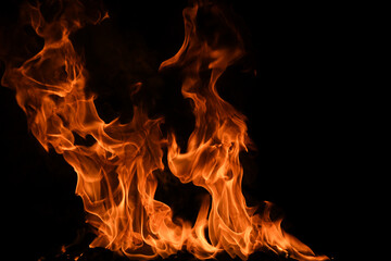 Texture of fire on a black background. Abstract fire flame background, large burning fire.