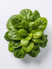 Fresh spinach leaves close up overhead shot on white background healthy eating ingredient vibrant green color