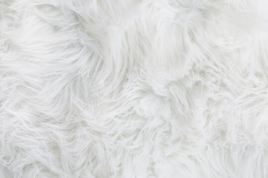 Full frame of soft fake white fur rug