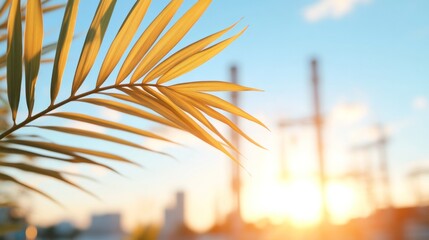 Sunny Palm frond and Power Plant: A close-up of a vibrant palm frond is backlit by the warm rays of the sun, set against a blurred backdrop of a power plant, symbolizing harmony and nature and energy