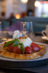 Tasty pastry with fresh toppings in a cozy restaurant