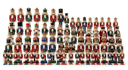 A delightful legion of nutcracker figurines, a whimsical army whisked together for the holidays on a white background