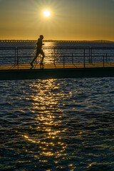 A man running early in the morning in Lisbon