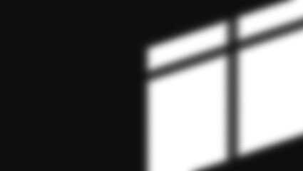 Abstract geometric shadow pattern from window light on dark background