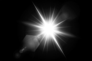 Bright starburst light effect with lens flare on black background