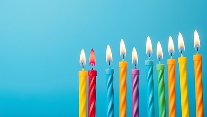 A row of colorful birthday candles with gentle flames, set against a solid blue background for festive occasions.
