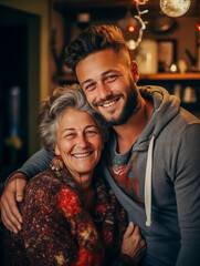 Portrait of a Cheerful man and his mature mother embracing at home