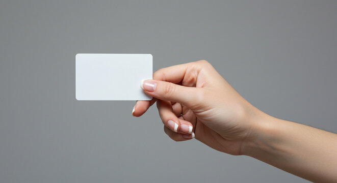 Elegant hand presenting blank white card for branding or identification, modern professional presentation