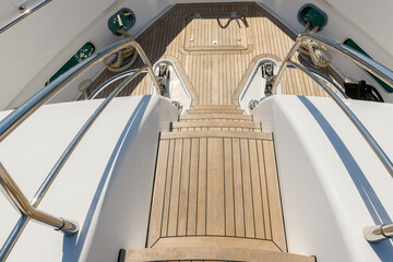 Fore deck of luxury super yacht. Teak deck on luxury yacht. Superyacht concept.
