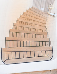 Teak stairs ladder on luxury yacht. Elements of yacht construction. Superyacht concept.