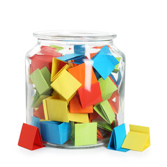 Many colorful paper pieces in glass jar isolated on white