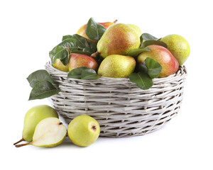 Fresh ripe pears with green leaves in wicker basket isolated on white