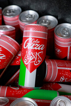 Bologna, ITALY - September 09 2025: Cans of GAZACOLA, on ice, close-up shot in vertical format