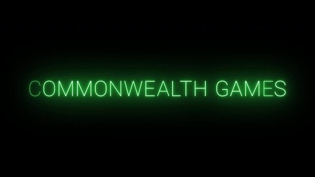 Flickering neon green commonwealth games sign animated on black background.
