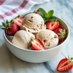 Bowl of homemade vanilla ice cream with fresh strawberries and mint leaves, a delightful summer treat on a marble surface, ready to be enjoyed